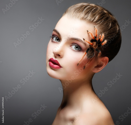 Photo: Fantasy. Spider sitting on Pretty Woman Face. Creativity Fantasy. Spider sitting on Pretty Woman Face. Creativity