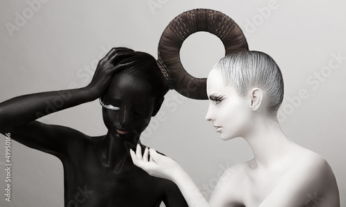 Photo: Ying & Yang Symbol. East. Women Painted Body in Black & White Ying & Yang Symbol. East. Women Painted Body in Black & White