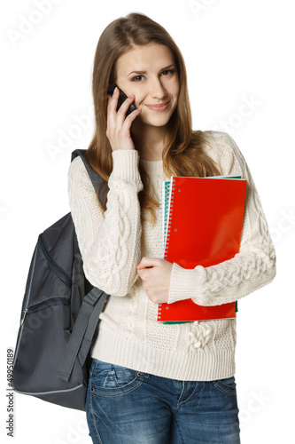Photo: Happy woman university student talking on cell phone Happy woman university student talking on cell phone