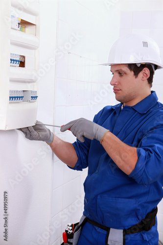 Photo: electrician with electric meter electrician with electric meter