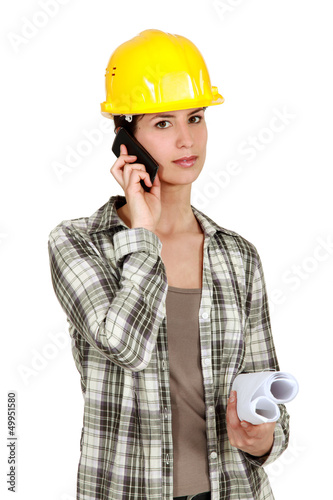 Photo: Tradeswoman using mobile phone Tradeswoman using mobile phone