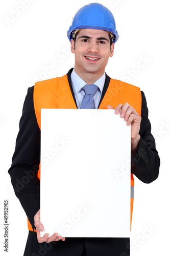 Photo: Inspector with a poster Inspector with a poster