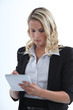 young businesswoman taking notes
