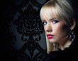 Beautiful blonde woman in luxury fur coat