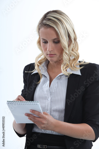 Photo: young businesswoman taking notes young businesswoman taking notes