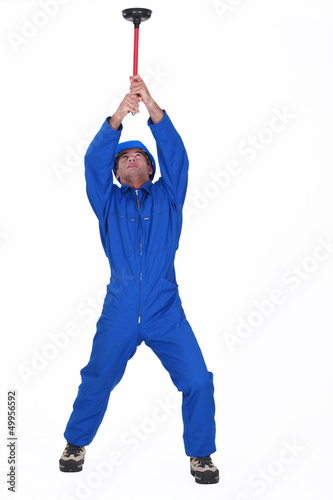 Photo: craftsman holding a plunger craftsman holding a plunger