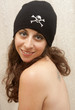 Smiling Brunette In Skull and Bones Cap