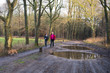 Photo: Man and boy walking with dog Man and boy walking with dog