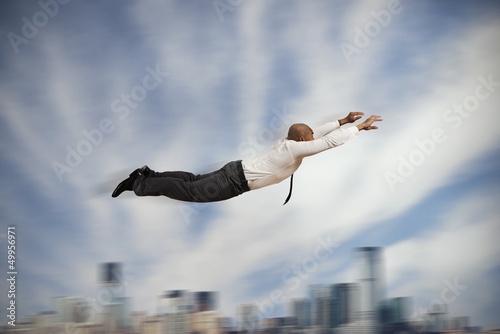 Photo: Flying Super hero businessman Flying Super hero businessman