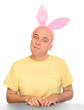 An happy man with pink rabbit ears. Happy easter concept.