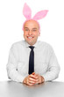 An successful manager with rabbit ears. Happy easter concept.