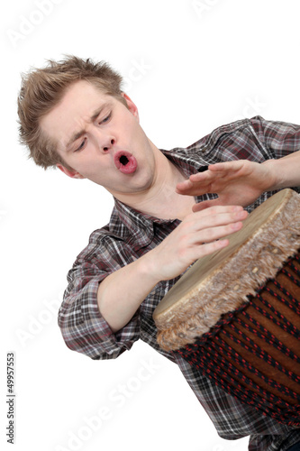 Photo: Oblique image of boy playing drum Oblique image of boy playing drum