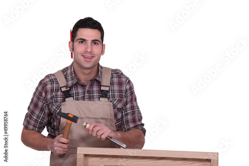 Photo: Carpenter carving wood Carpenter carving wood