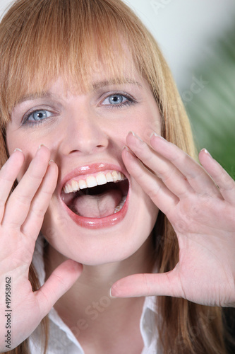 Photo: Closeup of a woman screaming Closeup of a woman screaming