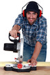 A carpenter with a circular saw.