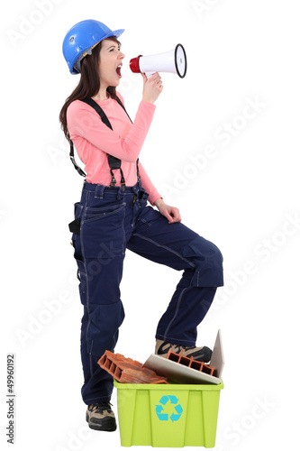 Photo: Female construction worker with a megaphone Female construction worker with a megaphone