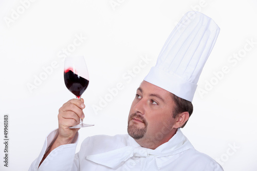 Photo: Chef with a glass of red wine Chef with a glass of red wine