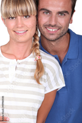 Photo: Closeup of smiling young couple Closeup of smiling young couple