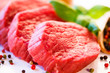 Photo: Raw beef and vegetables on white background Raw beef and vegetables on white background