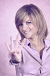 Photo: Smiling girl showing number four with fingers Smiling girl showing number four with fingers