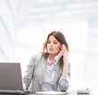 Photo: A young and smart businesswoman working in the office A young and smart businesswoman working in the office