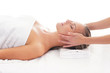 A young woman relaxing on a spa massage procedure