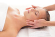 A young blond woman relaxing on a spa massage procedure