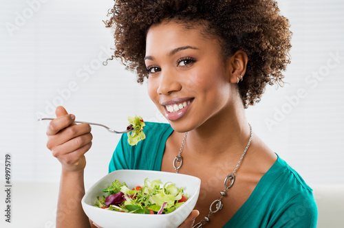 Photo: African American Woman Eating Salad African American Woman Eating Salad