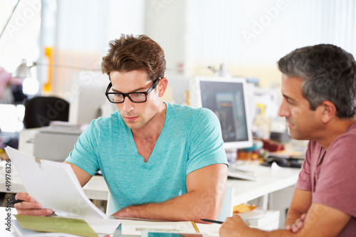 Photo: Two Men Meeting In Creative Office Two Men Meeting In Creative Office