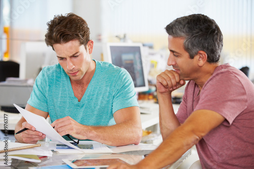 Photo: Two Men Meeting In Creative Office Two Men Meeting In Creative Office
