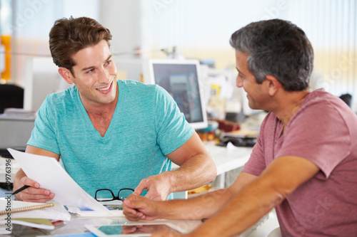 Photo: Two Men Meeting In Creative Office Two Men Meeting In Creative Office