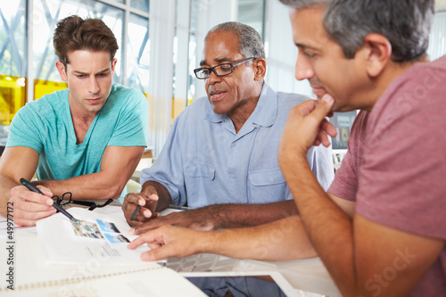 Photo: Group Of Men Meeting In Creative Office Group Of Men Meeting In Creative Office