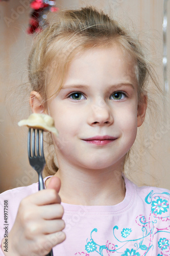 Photo: Girl eating dumplings Girl eating dumplings