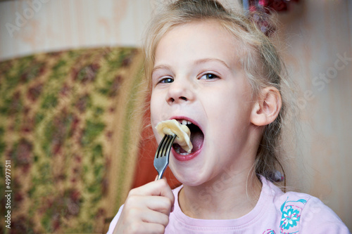 Photo: Girl eating dumplings Girl eating dumplings