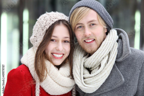 Photo: Young couple dressed in winter clothes Young couple dressed in winter clothes