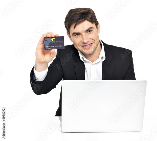 Photo: office worker with laptop and credit card office worker with laptop and credit card