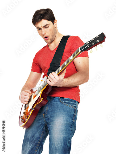 Photo: guitarist man plays on the electric guitar guitarist man plays on the electric guitar