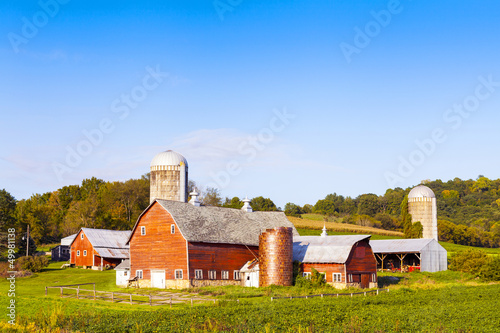 Photo: Traditional American Red Farm in Summer Traditional American Red Farm in Summer