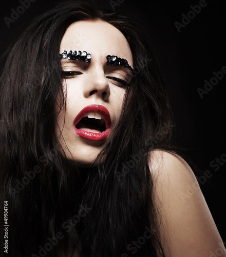 Photo: Character. Glossy Woman Face with Shiny Strass. Brilliance Character. Glossy Woman Face with Shiny Strass. Brilliance
