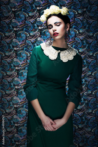 Photo: Romantic Young Styled Woman in Green Vintage Dress. Pin-up Romantic Young Styled Woman in Green Vintage Dress. Pin-up