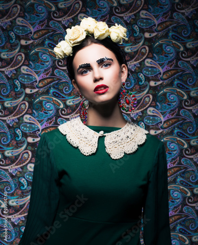 Photo: Elegant Lady in Green Dress and Roses. Retro Style Elegant Lady in Green Dress and Roses. Retro Style