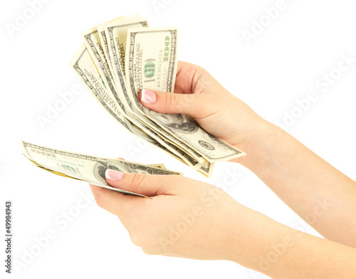 Photo: Woman recounts dollars, close up, isolated on white Woman recounts dollars, close up, isolated on white