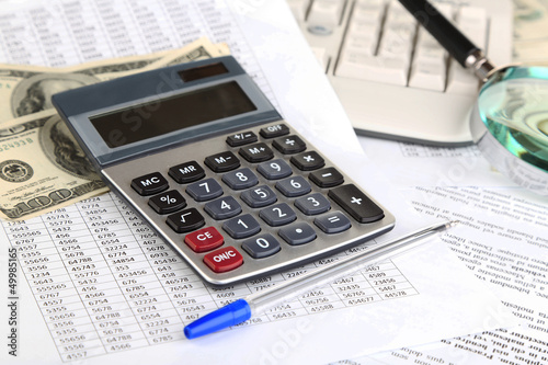 Photo: Financial information and money close-up Financial information and money close-up