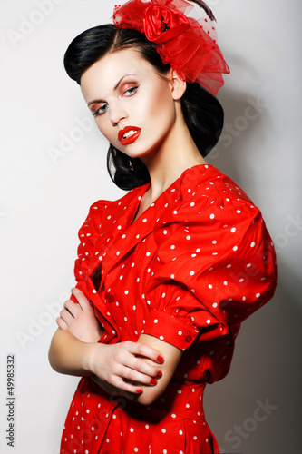 Photo: Arrogant Woman in Red Polka Dot Dress, Crossed Arms. Pin Up Arrogant Woman in Red Polka Dot Dress, Crossed Arms. Pin Up