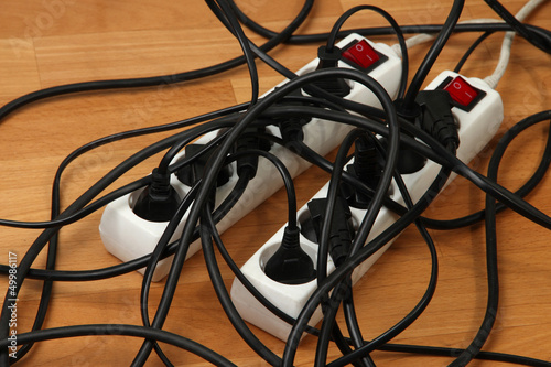 Photo: Overloaded power boards, close up Overloaded power boards, close up