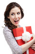 Young woman hands a new year's gift wrapped in red paper