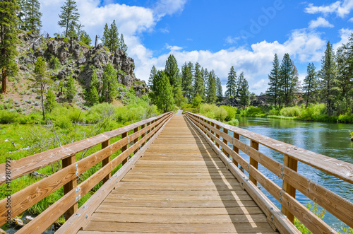 Photo: A Wooden Footbridge along a Trail A Wooden Footbridge along a Trail