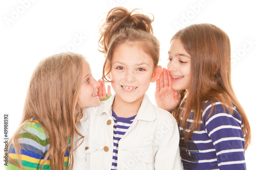 Photo: friends whispering secrets friends whispering secrets