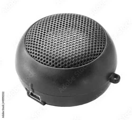 Photo: Portable mini speaker on a white background. Portable mini speaker on a white background.