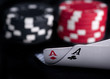 Photo: two aces high on black table with chips two aces high on black table with chips